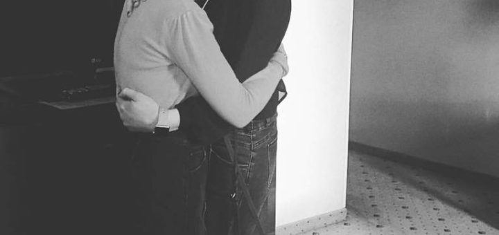 casey and cassandra hugging and smiling at the camera in black and white, march 2017